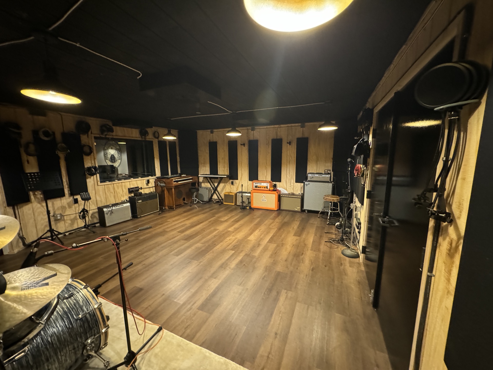 Long Road Recording live room with reclaimed wood paneling and amplifiers